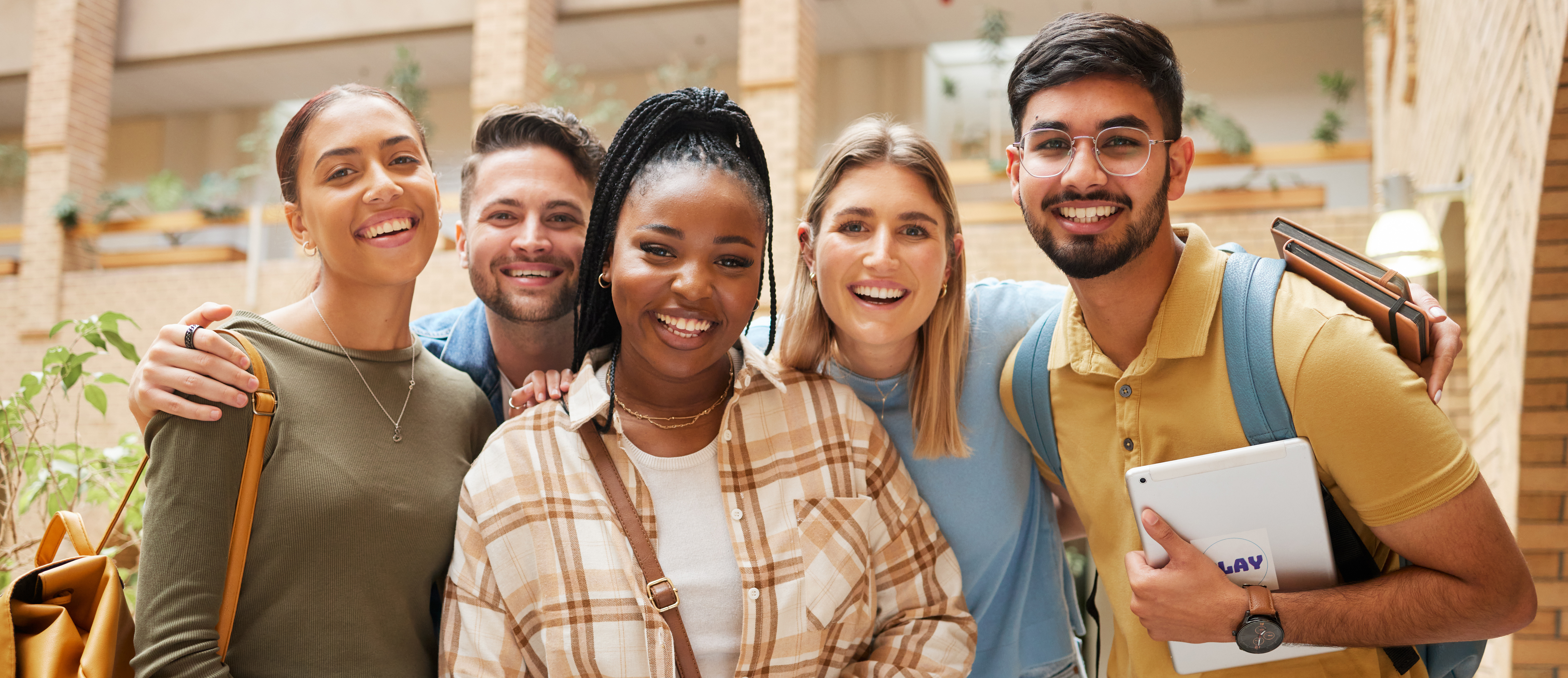 Portrait, university students and group of friends getting ready for learning. Scholarship, education or happy people standing together at school, campus or college bonding and preparing for studying